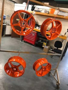 4 refurbished alloy wheels with new paint job which is orange